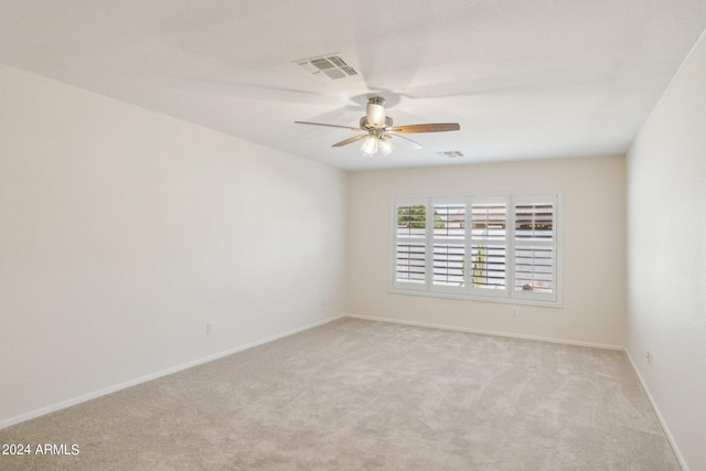 15016 W Monterey Way, Goodyear, AZ 85395 - unfurnished room with light colored carpet, visible vents, baseboards, and a ceiling fan