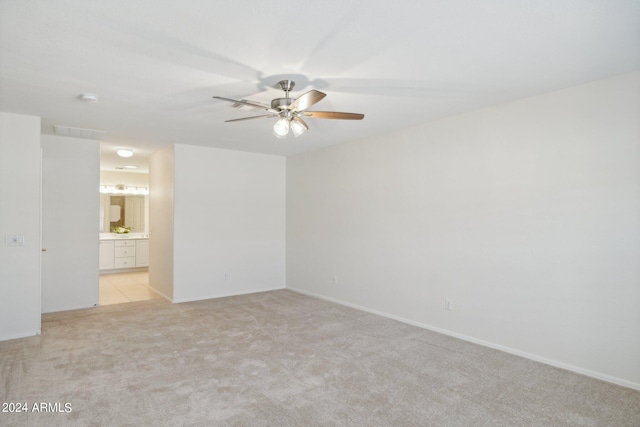 15016 W Monterey Way, Goodyear, AZ 85395 - empty room with ceiling fan, light colored carpet, baseboards, and visible vents
