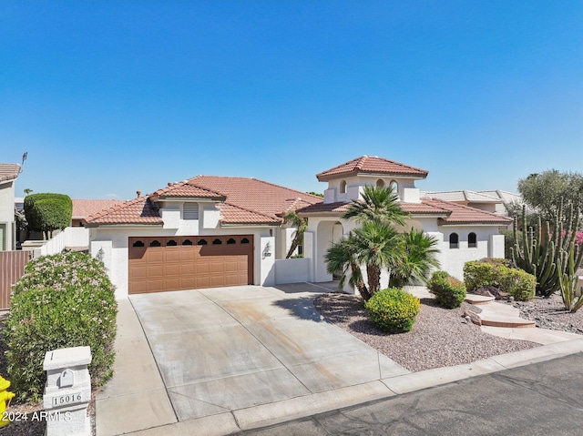 mediterranean / spanish-style home featuring a garage