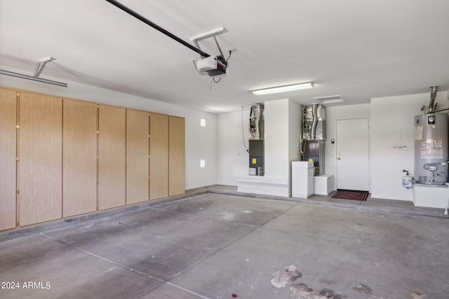 garage with heating unit, a garage door opener, and gas water heater