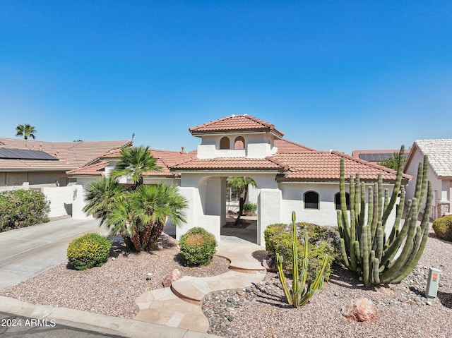 15016 W Monterey Way, Goodyear, AZ 85395 - mediterranean / spanish-style house featuring stucco siding, fence, a tiled roof, and driveway