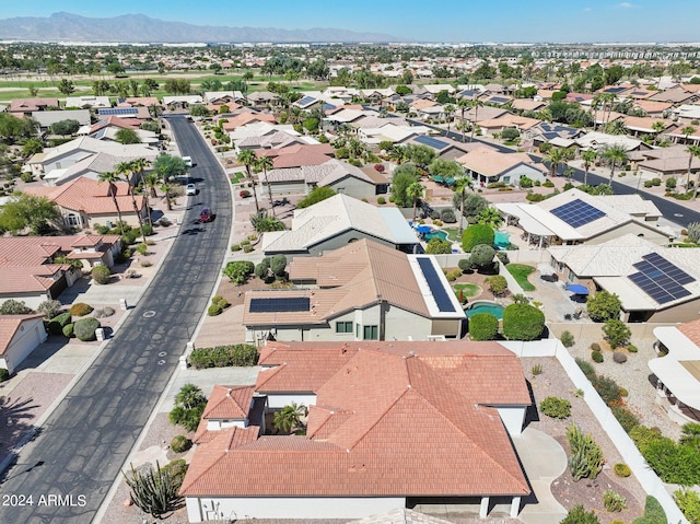 birds eye view of property with a mountain view