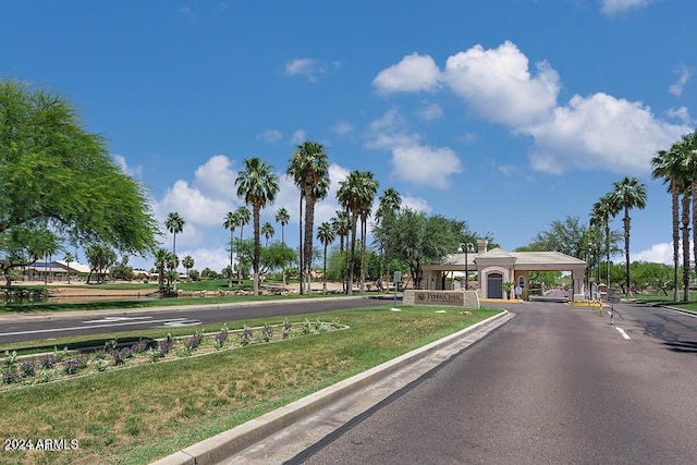 15016 W Monterey Way, Goodyear, AZ 85395 - view of road featuring curbs and a gated entry