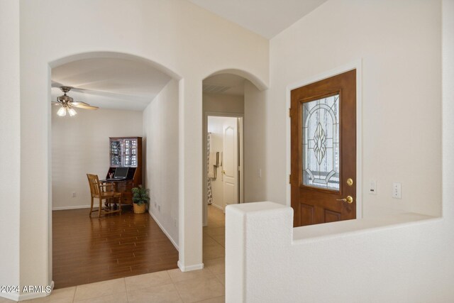 entryway with ceiling fan and light wood-type flooring