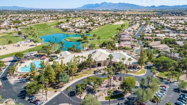 drone / aerial view with a water and mountain view