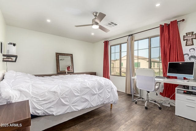 bedroom with dark wood-type flooring and ceiling fan