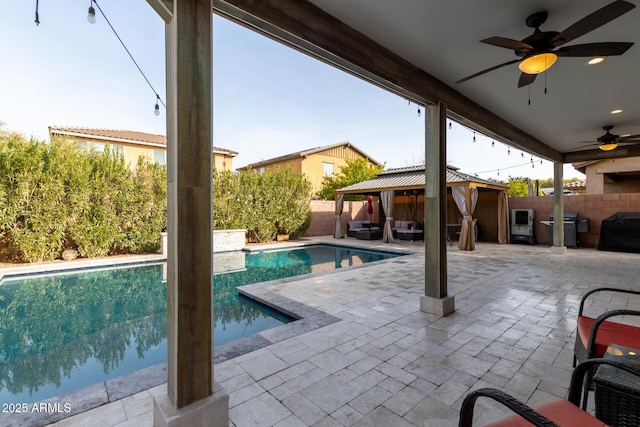 view of pool featuring a grill and a patio