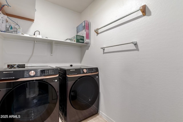 clothes washing area featuring washer and clothes dryer