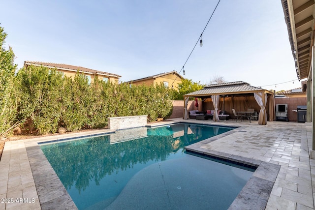 view of swimming pool with a gazebo and a patio area