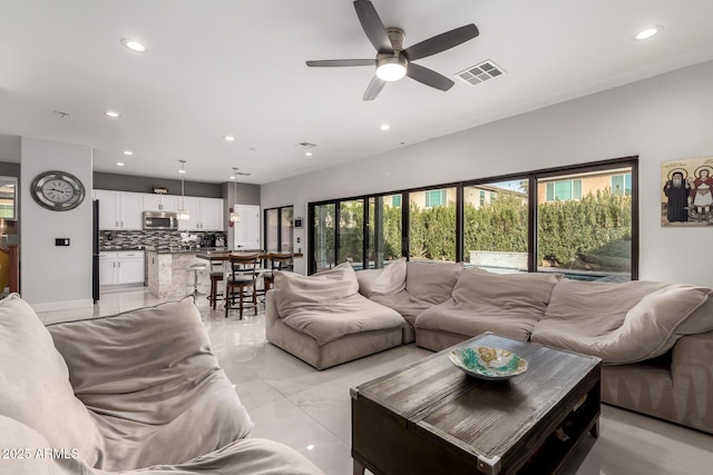 living room featuring ceiling fan