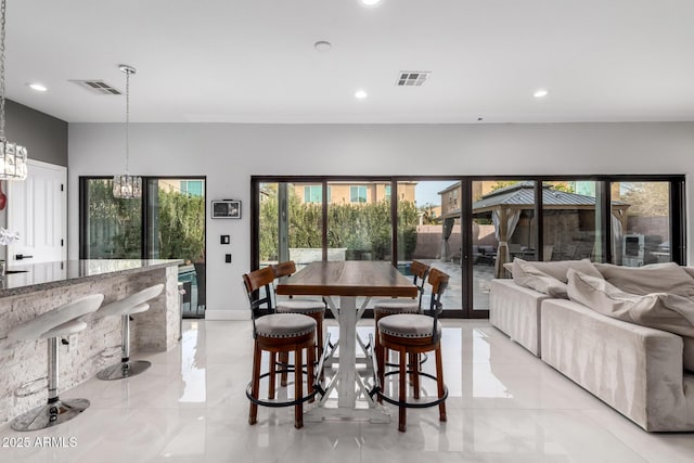 dining room featuring a chandelier and french doors