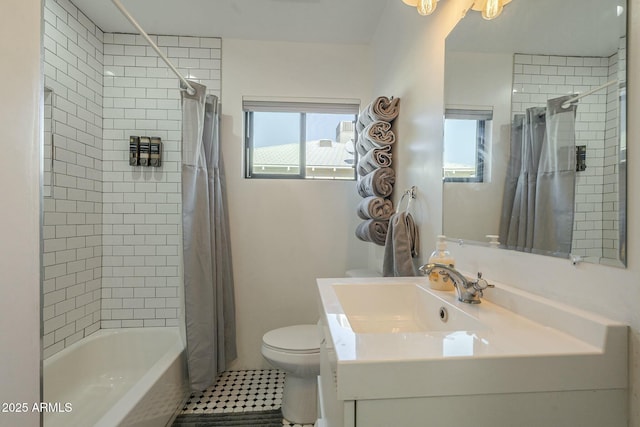 full bathroom featuring vanity, shower / tub combo, tile patterned floors, and toilet