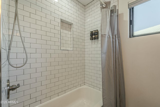 bathroom featuring shower / tub combo with curtain