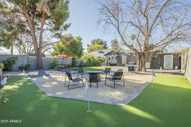 view of patio / terrace featuring area for grilling and a fire pit