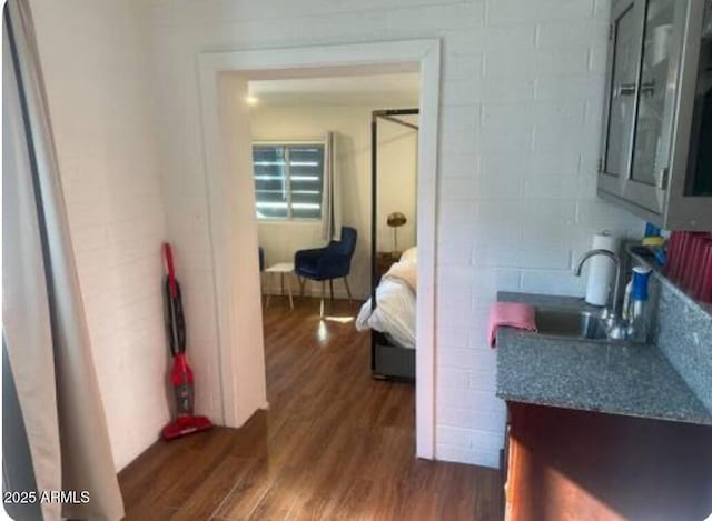 interior space with sink and hardwood / wood-style floors