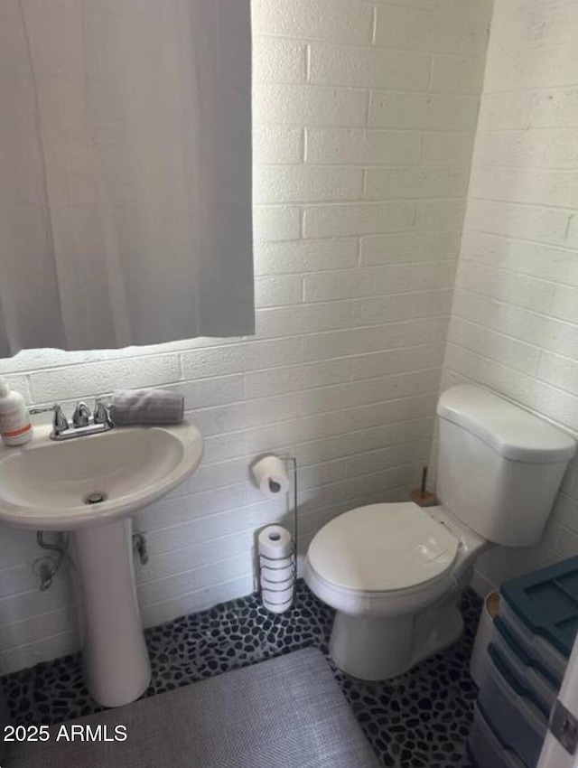 bathroom with tile patterned flooring and toilet