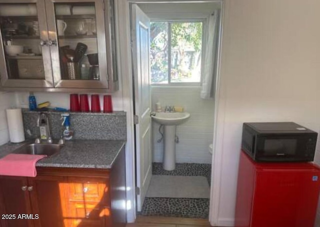 bathroom featuring tile patterned flooring and sink