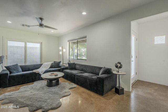 living room featuring concrete floors and ceiling fan
