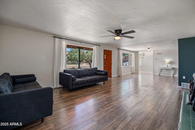 126 E Cattle Ln, Taylor, AZ 85939 - living area with a ceiling fan, wood finished floors, and a textured ceiling