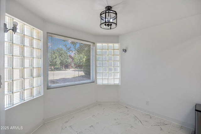 126 E Cattle Ln, Taylor, AZ 85939 - unfurnished dining area featuring light marble finish floors and a chandelier