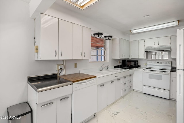 126 E Cattle Ln, Taylor, AZ 85939 - kitchen with white appliances, under cabinet range hood, light marble finish flooring, white cabinets, and light countertops