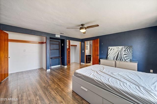 126 E Cattle Ln, Taylor, AZ 85939 - bedroom featuring wood finished floors, multiple closets, and a ceiling fan