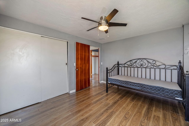 126 E Cattle Ln, Taylor, AZ 85939 - bedroom with wood finished floors, a closet, and ceiling fan