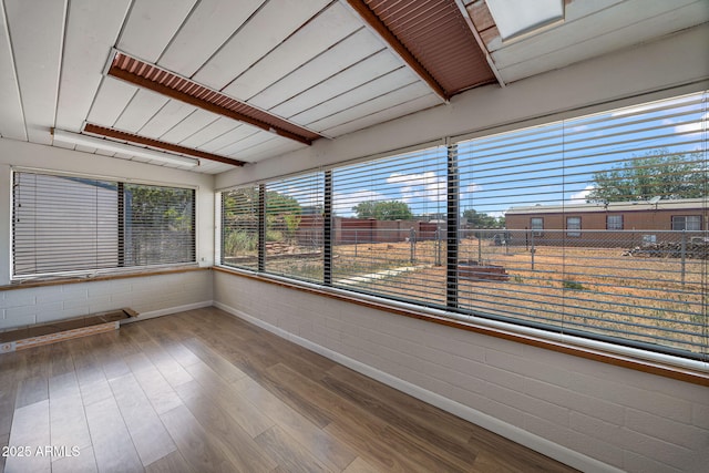 126 E Cattle Ln, Taylor, AZ 85939 - unfurnished sunroom featuring plenty of natural light and wood finished floors