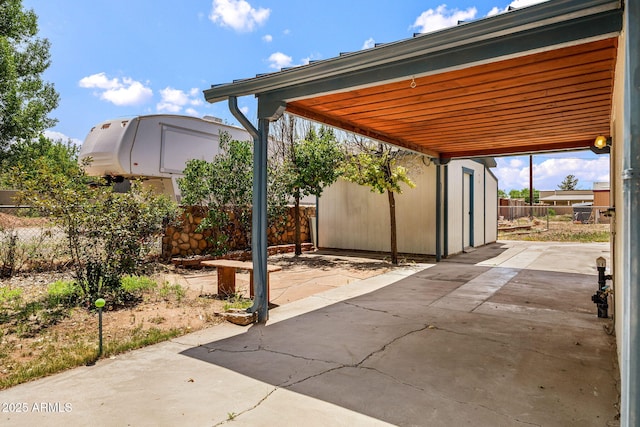 126 E Cattle Ln, Taylor, AZ 85939 - view of patio / terrace featuring an outdoor structure and a carport