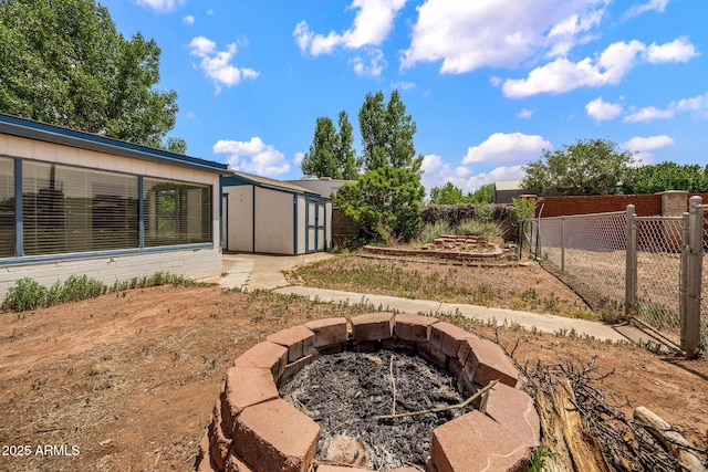126 E Cattle Ln, Taylor, AZ 85939 - view of yard with a fire pit and a storage shed
