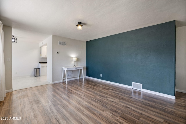 126 E Cattle Ln, Taylor, AZ 85939 - unfurnished living room with wood finished floors and baseboards