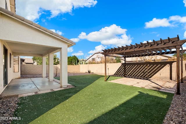 view of yard with a pergola and a patio