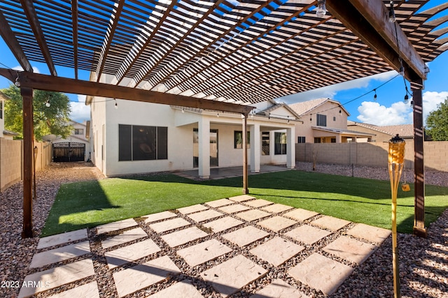 rear view of house with a lawn, a patio, and a pergola