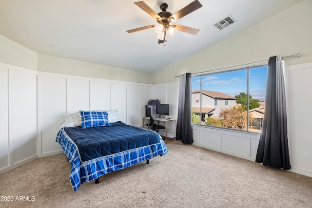 carpeted bedroom featuring lofted ceiling and ceiling fan