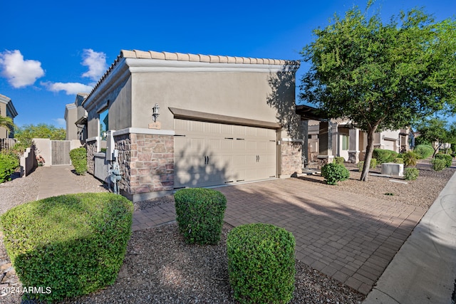 view of side of home featuring a garage