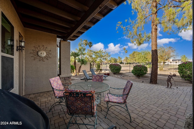 view of patio featuring a fenced backyard and outdoor dining space