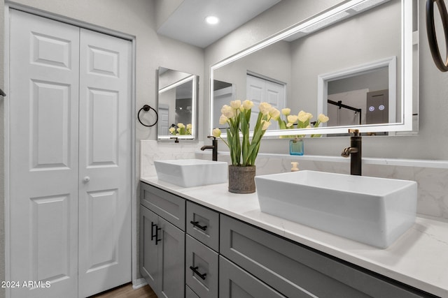 bathroom with vanity and hardwood / wood-style flooring