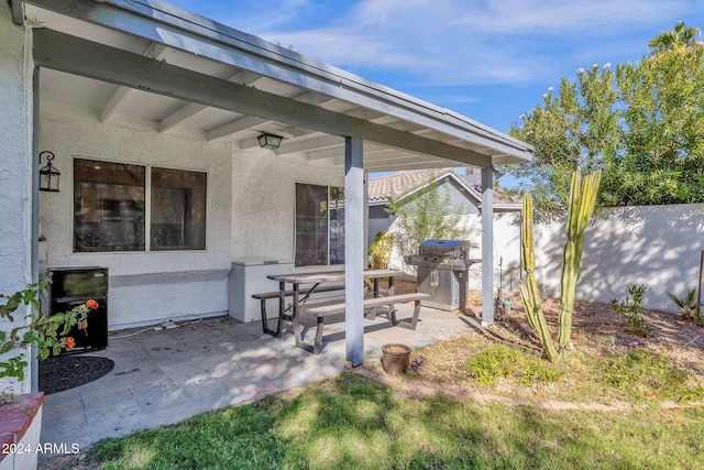 view of patio with a grill