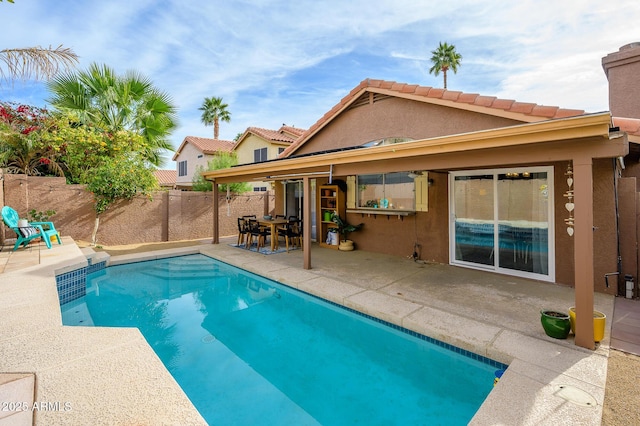 view of swimming pool featuring a patio