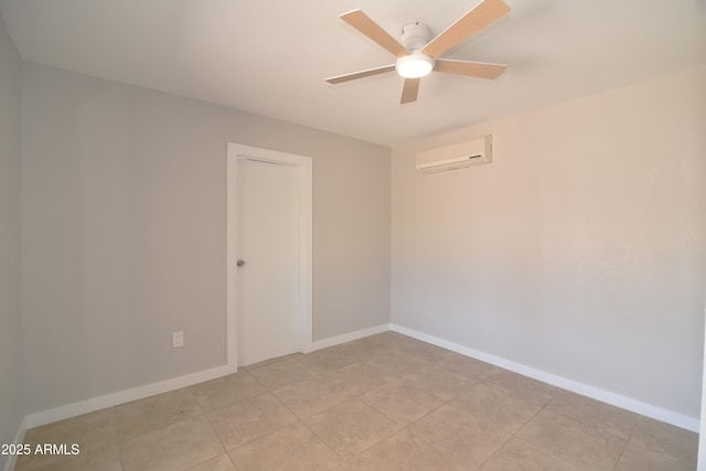 3640 W Garfield St, Phoenix, AZ 85009 - empty room featuring a wall unit AC, ceiling fan, baseboards, and light tile patterned floors