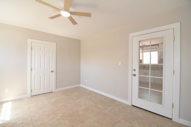 3640 W Garfield St, Phoenix, AZ 85009 - empty room featuring a ceiling fan, baseboards, and light tile patterned floors