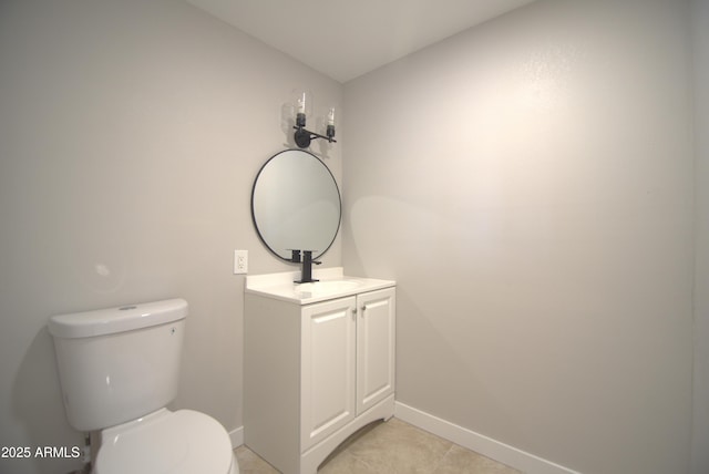 3640 W Garfield St, Phoenix, AZ 85009 - half bath featuring baseboards, toilet, and vanity