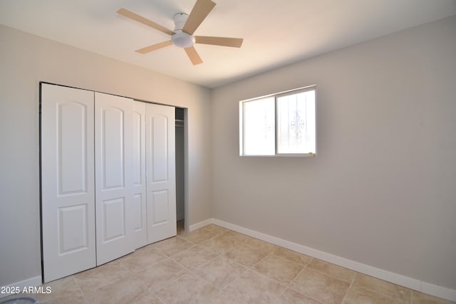3640 W Garfield St, Phoenix, AZ 85009 - unfurnished bedroom featuring a closet, baseboards, and ceiling fan