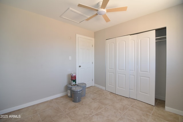 3640 W Garfield St, Phoenix, AZ 85009 - unfurnished bedroom featuring attic access, a closet, baseboards, and light tile patterned floors