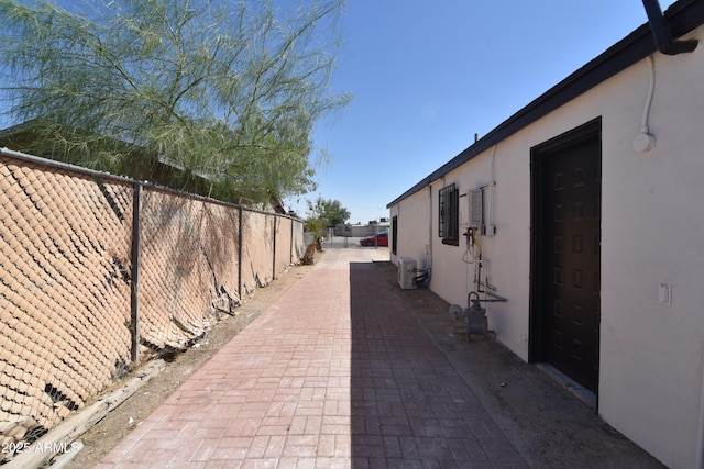 3640 W Garfield St, Phoenix, AZ 85009 - view of side of home featuring stucco siding