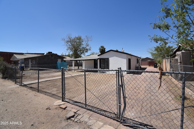 3640 W Garfield St, Phoenix, AZ 85009 - ranch-style home featuring a gate, concrete driveway, and stucco siding
