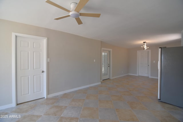 3640 W Garfield St, Phoenix, AZ 85009 - unfurnished room with a chandelier, ceiling fan, and baseboards