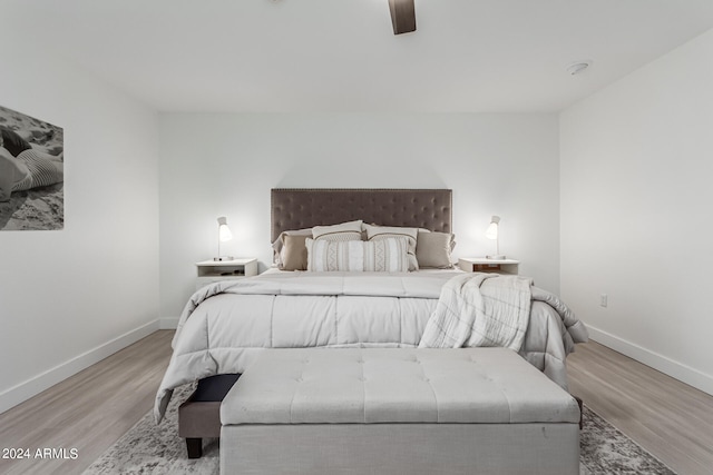 bedroom featuring light hardwood / wood-style floors and ceiling fan