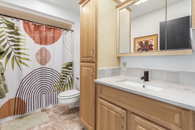 bathroom featuring vanity, toilet, curtained shower, and tile patterned flooring