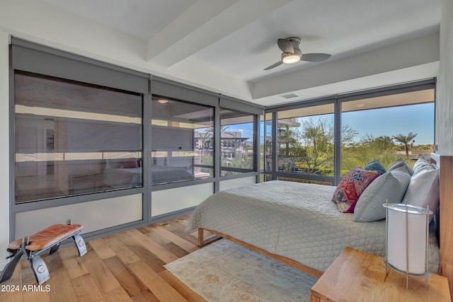 bedroom with wood-type flooring and ceiling fan